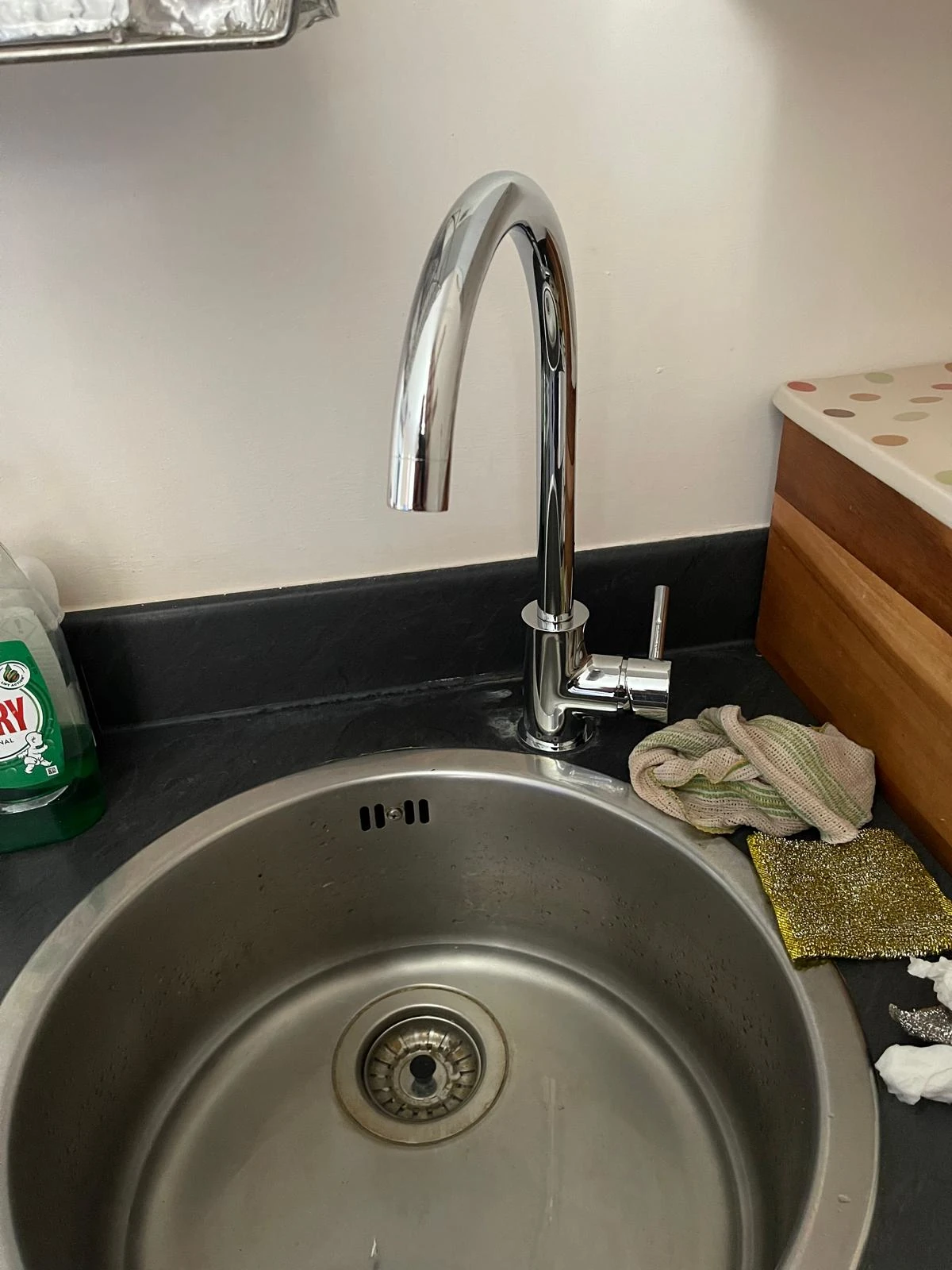 New tap installation completed at a kitchen sink
